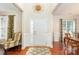 Welcoming foyer featuring hardwood floors, complemented by elegant trim and sunburst decoration at 1006 Apogee Dr, Indian Trail, NC 28079