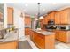 Well-equipped kitchen with center island, stainless appliances, and ample cabinet space at 1006 Apogee Dr, Indian Trail, NC 28079