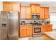 Stainless appliances accent this kitchen with ample cabinets and grey backsplash at 1006 Apogee Dr, Indian Trail, NC 28079