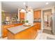 Spacious kitchen features a center island, modern appliances, and tile backsplash at 1006 Apogee Dr, Indian Trail, NC 28079