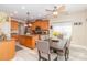Bright eat-in kitchen boasts wood cabinets, granite counters, island, and stainless appliances at 1006 Apogee Dr, Indian Trail, NC 28079