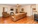 Inviting living room with cozy seating, fireplace, and warm wood flooring at 1006 Apogee Dr, Indian Trail, NC 28079