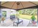 Outdoor patio area with an outdoor gazebo, furniture and a lush green lawn at 1006 Apogee Dr, Indian Trail, NC 28079