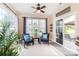 Bright sunroom features comfortable seating, sliding glass door, and plenty of natural light at 1006 Apogee Dr, Indian Trail, NC 28079
