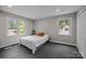 Minimalist bedroom with ample natural light and neutral decor at 1013 Eaglewood Ave, Charlotte, NC 28212