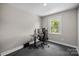 This bedroom features a computer desk and chair with natural light streaming through the window at 1013 Eaglewood Ave, Charlotte, NC 28212