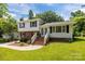 Charming two-story home with brick and white siding, black shutters, and inviting front yard at 1013 Eaglewood Ave, Charlotte, NC 28212