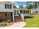 Charming two-story home with brick and white siding, black shutters, and inviting front yard at 1013 Eaglewood Ave, Charlotte, NC 28212