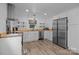 Bright modern kitchen with stainless steel appliances, white cabinets, hardwood floors and wooden countertops at 1013 Eaglewood Ave, Charlotte, NC 28212