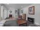 Bright living room with neutral paint and hardwood floors. Staircase is visible at 1013 Eaglewood Ave, Charlotte, NC 28212