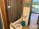 Bathroom with a toilet, shower-tub, and welcoming lake themed decor at 104 Deer Park Rd # D143, Mount Gilead, NC 27306