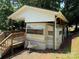 View of the home with a large covered deck and front awning at 104 Deer Park Rd # D143, Mount Gilead, NC 27306