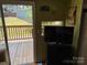 View from inside to deck with camper signage on the wall and natural light at 104 Deer Park Rd # D143, Mount Gilead, NC 27306