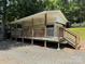 Inviting exterior deck with ceiling fans and wooden railings at 104 Deer Park Rd # D143, Mount Gilead, NC 27306