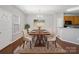 Bright dining room boasts stylish decor and a large window at 10446 Trolley Run Dr, Cornelius, NC 28031