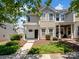 Charming townhome with a well-manicured lawn and welcoming front porch at 10446 Trolley Run Dr, Cornelius, NC 28031