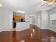 Open-concept living area features hardwood floors and plenty of natural light at 10446 Trolley Run Dr, Cornelius, NC 28031