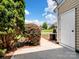 View of the outdoor patio with lush greenery and a view of the community at 10446 Trolley Run Dr, Cornelius, NC 28031