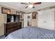 Bedroom featuring ceiling fan, closet, dresser, and natural lighting at 1162 E Doc Garris Rd, Lancaster, SC 29720