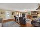 Inviting living room with a brick fireplace, hardwood floors, comfortable seating, and plenty of natural light at 1162 E Doc Garris Rd, Lancaster, SC 29720