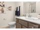 Bathroom with a single sink vanity, a shower, and fun, colorful decor at 12016 Basking Dr, Charlotte, NC 28214