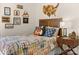 A well decorated bedroom featuring colorful bedding, and a wooden headboard at 12016 Basking Dr, Charlotte, NC 28214