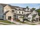 Charming, new construction townhomes with inviting front porches and well-manicured lawns at 12016 Basking Dr, Charlotte, NC 28214