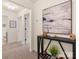 Hallway featuring neutral walls, carpeting, and decor with views into other rooms at 12016 Basking Dr, Charlotte, NC 28214