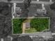 Aerial view of a property showcasing its generous lot size surrounded by lush trees at 1256 Canseco Ln, Hickory, NC 28602