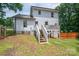 Backyard view with deck, stairs, and grass at 1256 Canseco Ln, Hickory, NC 28602