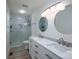 Bathroom with double sink vanity, a large mirror, and frameless glass shower at 1256 Canseco Ln, Hickory, NC 28602