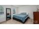 Bedroom featuring a large mirror and a bright window at 1256 Canseco Ln, Hickory, NC 28602