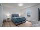 Bedroom featuring a bed with side tables and lamps at 1256 Canseco Ln, Hickory, NC 28602