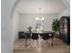 Elegant dining room with a rustic wooden table, stylish chairs, and natural light from the window at 1256 Canseco Ln, Hickory, NC 28602