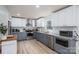 Bright kitchen with stainless steel appliances, white and gray cabinetry, and stylish marble backsplash at 1256 Canseco Ln, Hickory, NC 28602