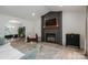 Inviting living room with a fireplace, large television, and an open design to the dining area at 1256 Canseco Ln, Hickory, NC 28602
