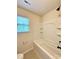 Bathroom featuring a tub and shower combination, updated fixtures, and tile flooring at 1304 Ridge Haven Rd, Waxhaw, NC 28173