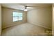 Neutral bedroom featuring a ceiling fan and carpeted flooring at 1304 Ridge Haven Rd, Waxhaw, NC 28173