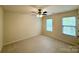 Neutral bedroom featuring a ceiling fan and carpeted flooring at 1304 Ridge Haven Rd, Waxhaw, NC 28173
