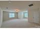 Large bonus room with neutral carpet, two windows, and recessed lighting at 1304 Ridge Haven Rd, Waxhaw, NC 28173