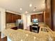 Well-appointed kitchen featuring granite countertops, stainless steel appliances, and abundant cabinet space at 1304 Ridge Haven Rd, Waxhaw, NC 28173