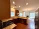 Open-concept kitchen with stainless steel appliances, granite countertops, and a seamless flow to the living area at 1304 Ridge Haven Rd, Waxhaw, NC 28173