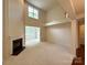 Bright living room with fireplace, high ceilings, and view into the sunroom at 1304 Ridge Haven Rd, Waxhaw, NC 28173