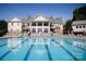 Resort-style pool area with an elegant clubhouse and ample lounge chairs, perfect for relaxation and recreation at 1304 Ridge Haven Rd, Waxhaw, NC 28173