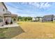 Expansive backyard with a well-maintained lawn, ideal for outdoor activities and relaxation at 13140 Sudwick Ln, Charlotte, NC 28278