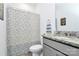 This bathroom features modern sink and updated tile on the shower wall at 13140 Sudwick Ln, Charlotte, NC 28278