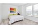 A cozy bedroom features neutral walls, carpet, and a bed with white and yellow linens at 13140 Sudwick Ln, Charlotte, NC 28278