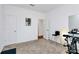 Bright bedroom with neutral carpet, and a modern exercise bike at 13140 Sudwick Ln, Charlotte, NC 28278