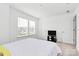 A bright bedroom features neutral walls, carpet, and a bed with white linens at 13140 Sudwick Ln, Charlotte, NC 28278