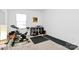 Bright bedroom with neutral carpet, and a modern exercise bike at 13140 Sudwick Ln, Charlotte, NC 28278